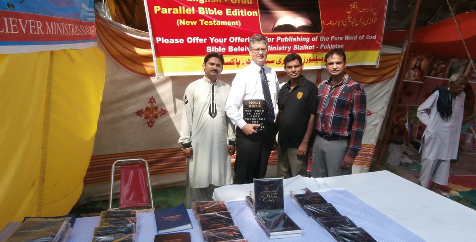 Ministry team in Pakistan introducing parallel English/Urdu NT we have printed